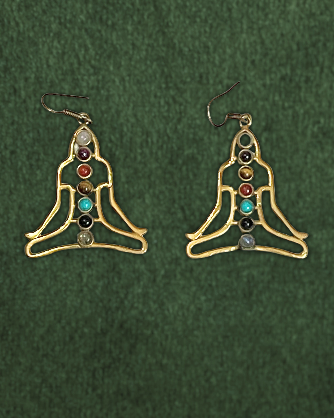 Meditative pose with 7 chakra stones